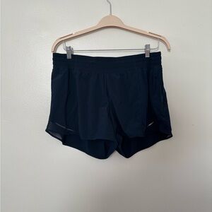 Lululemon Navy Blue Hotty Hot short 4 inch, 
lined ,Size 14